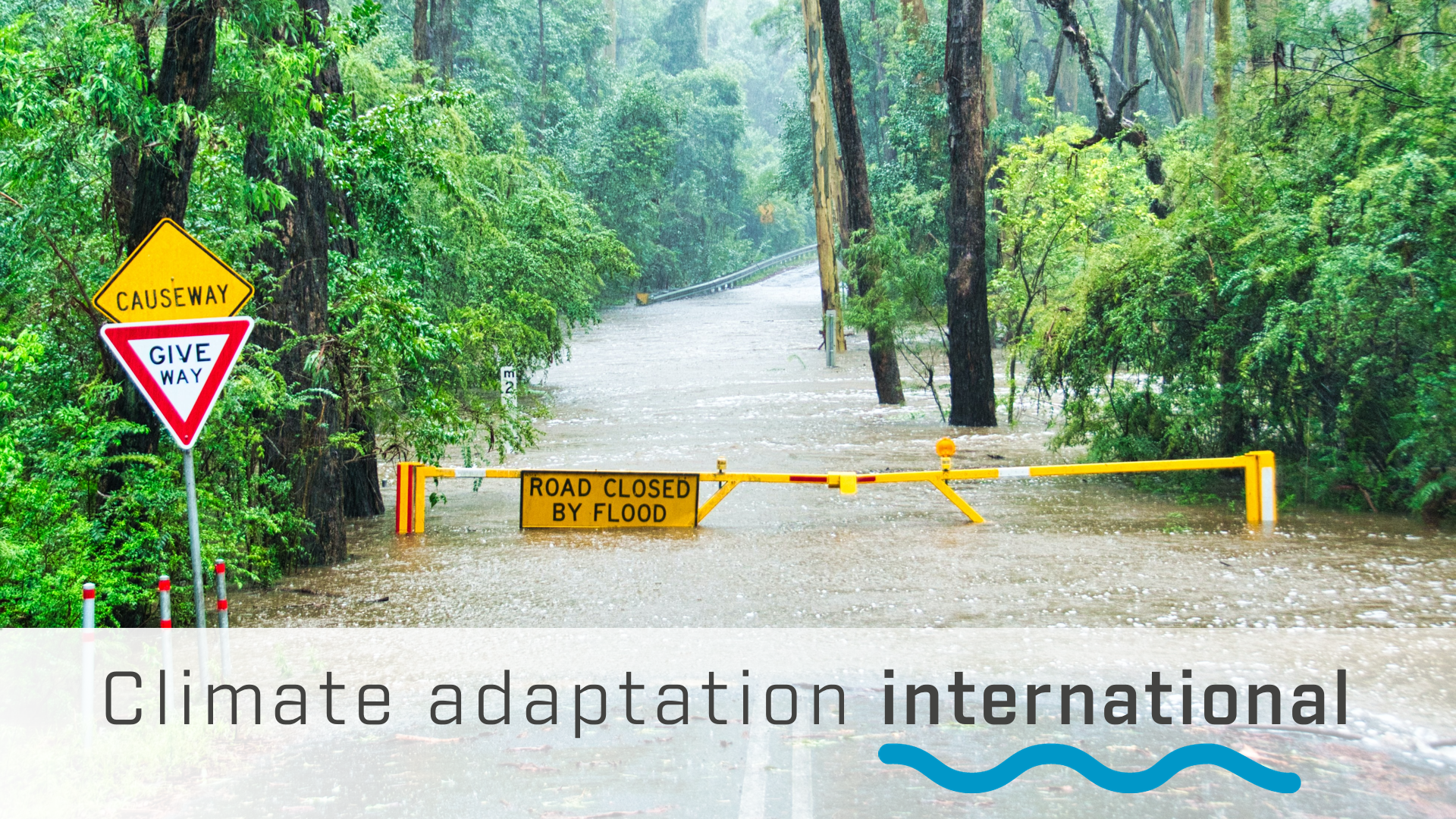 A road closed due to flooding with the title Climate adaptation international.
